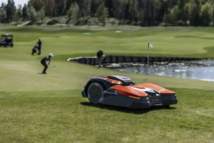 Husqvarna autonomous mowers cutting fairways at a golf major