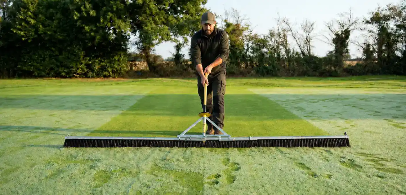 Dew removal is one of autumn golf course maintenance tassk doing in the morning